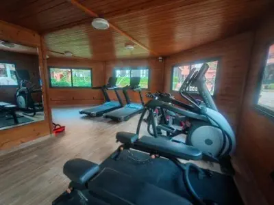 a gym with a row of exercise bikes in it at Appart Kech Village in Marrakech