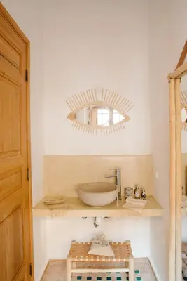a bathroom with a sink and a mirror on the wall at Riad Le Pèlerin in Marrakech