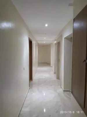an empty hallway with white walls and a hallwayngth at Opéra Appartement, Hivernage Marrakech. in Marrakech