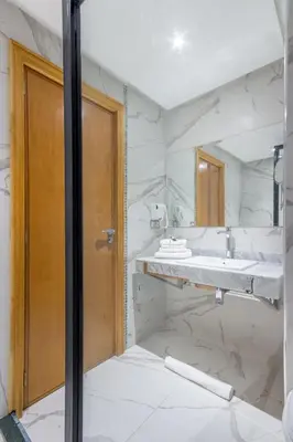 a bathroom with a sink and a mirror at Best for group, 5 min from medina in Marrakech