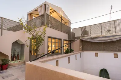 an external view of a house with a balcony at Riad Hissan in Marrakech