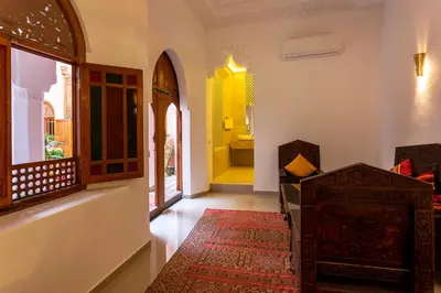 a hallway with a room with a bathroom with a tub at Riad Agdal Royal & Spa in Marrakech