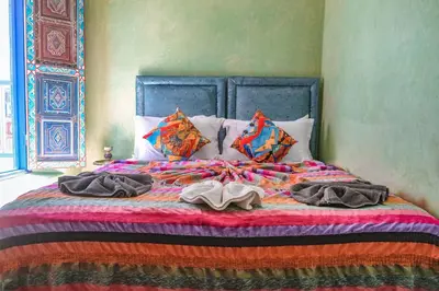 a bed with two towels on top of it at Héritage Lalla Aicha Hotel & Spa in Marrakech