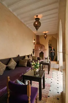 a living room with a couch and a table at Riad Papillon by Marrakech Riad in Marrakech