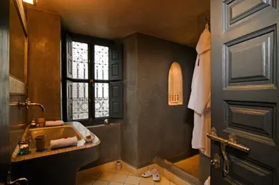 a bathroom with a sink and a window at Riad Cinnamon by Marrakech Riad in Marrakech