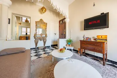 a living room with a couch and a piano at Dar Noubti in Marrakech