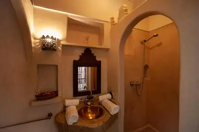 a bathroom with a sink and a mirror at Riad Khabia & Spa in Marrakech