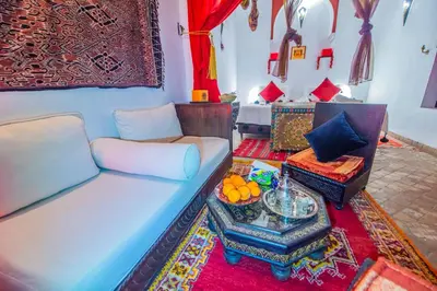 a living room with a couch and a table at Riad Khabia & Spa in Marrakech