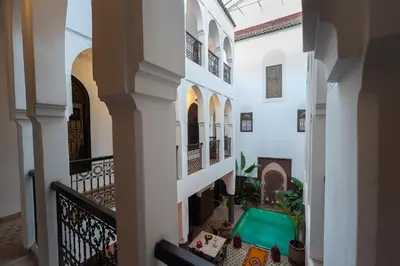 an alleyway with a pool in the middle of a building at Riad Khabia & Spa in Marrakech