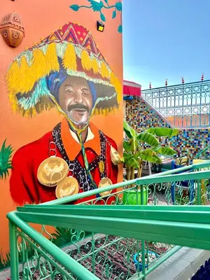 a painting of a man wearing a sombrero at Riad Eva in Marrakech