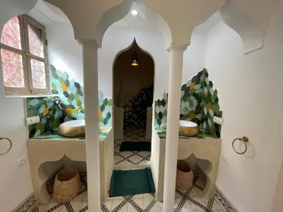 a hallway in a house with a tile floor at RIAD ZEFYR in Marrakech
