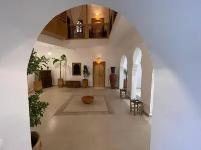 a large hallway with an archway in a building at RIAD ZEFYR in Marrakech