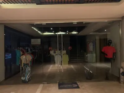 a room with a glass door with a motorcycle in it at Marrakech Prestigia Jade Golf Piscine in Marrakech