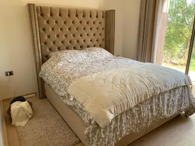 a bedroom with a large bed with a large window at Marrakech Prestigia Jade Golf Piscine in Marrakech