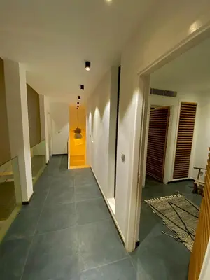 an empty hallway with a yellow door in a house at Riad Love B&B in Marrakech