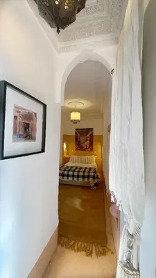 a bedroom with a bed in a room at Riad Chocolat in Marrakech