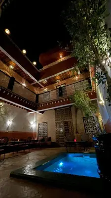 a large swimming pool in a building with at Riad Naya in Marrakech