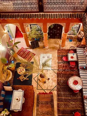 an overhead view of a living room with a table and chairs at Riad Naya in Marrakech