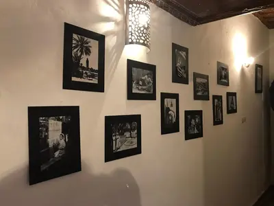 a wall with pictures of people on it at Riad Naya in Marrakech