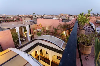 a view of a city from the balcony of a building at Riad Dabachi in Marrakech