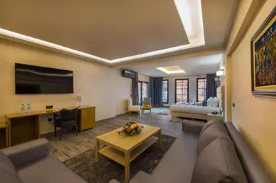 a living room with a couch and a table at Stars Hotel & Spa in Marrakech