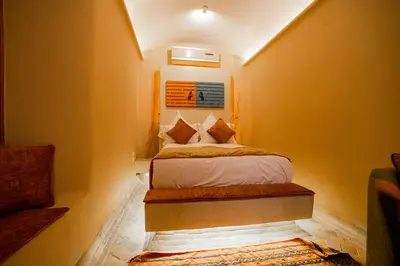 a small bedroom with a bed in a room at MAISON MK Adults ONLY - Music Riad in Marrakech