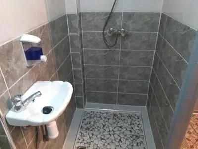 a bathroom with a sink and a shower at studio Dar Rmila in Marrakech