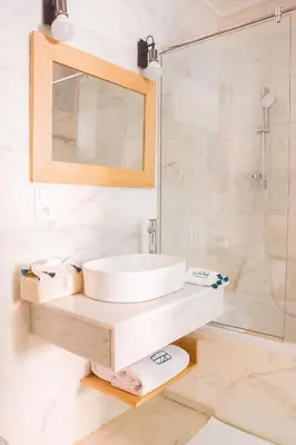 a bathroom with a sink and a shower at Le Pavillon de la Kasbah & SPA Marrakech in Marrakech