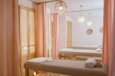 a bathroom with a mirror and a sink and a tub at Le Pavillon de la Kasbah & SPA Marrakech in Marrakech