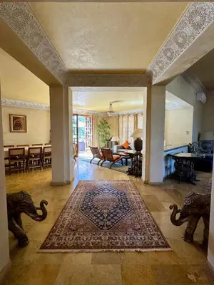 a large living room with a rug on the floor at Villa Ross in Marrakech