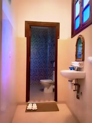 a bathroom with a sink and a toilet at DAR AZIZ in Marrakech