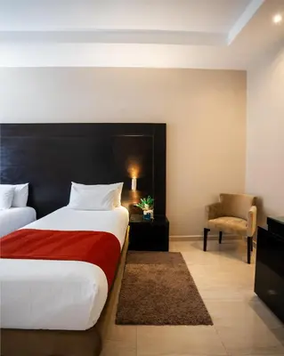 a hotel room with a bed and a chair at Kech Boutique Hotel in Marrakech