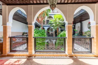 an entrance to a building with an iron gate at Riad Espoir, Riad de charme en exclusivité dans la médina de Marrakech in Marrakech