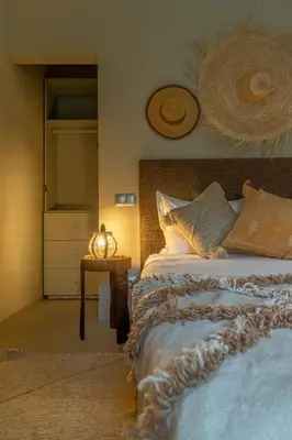 a bedroom with a bed and a table with a lamp at VILLA MARIA - Famille uniquement in Marrakech