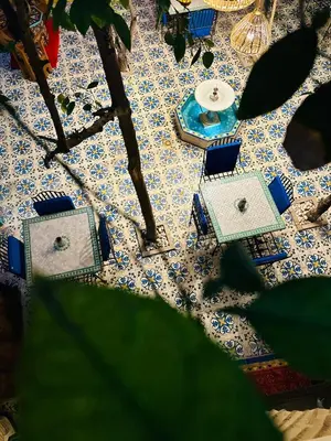 an overhead view of a table with blue and white tiles at Riad Al Nour in Marrakech