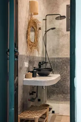 a bathroom with a sink and a glass shower at Riad Darsahalia in Marrakech