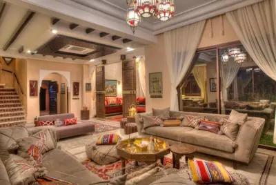 a large living room with couches and a table at Villa Tilila in Marrakech