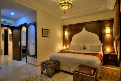 a bedroom with a large bed in a room at Villa Tilila in Marrakech
