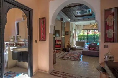 a bathroom with a sink and a mirror in a room at Villa Tilila in Marrakech