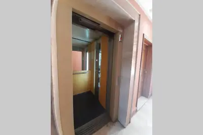 a hallway in a building with a mirror at Hivernage - Stylish APT in the Heart of the City in Marrakech