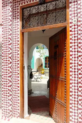 an open door to a building with a patio at Riad Dar Aida in Marrakech
