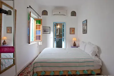 a bedroom with a large bed in a room at Riad Dar Aida in Marrakech