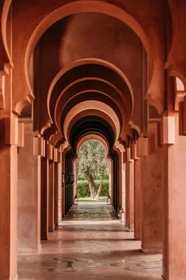 an arcade of a building with an archway at Amanjena Resort in Marrakech