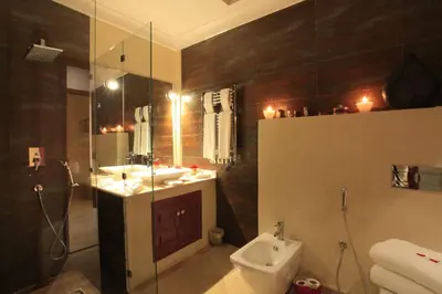 a bathroom with a toilet and a sink and a shower at Riad Infinity Sea in Marrakech