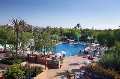 a pool at a resort with a lot of people at Valeria Madina Club - All Inclusive in Marrakech