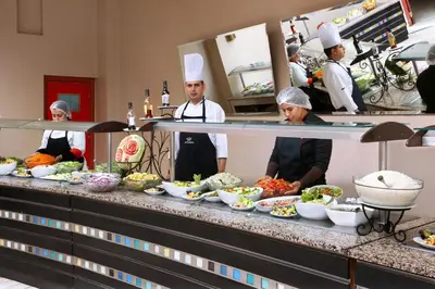 a group of chefs in a kitchen preparing food at Valeria Madina Club - All Inclusive in Marrakech
