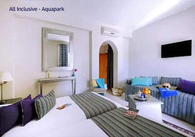 a living room with a bed and a couch at Valeria Dar Atlas All Inclusive in Marrakech