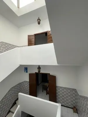 a view from the top of a building with a staircase at Riad NEJJARINE in Marrakech
