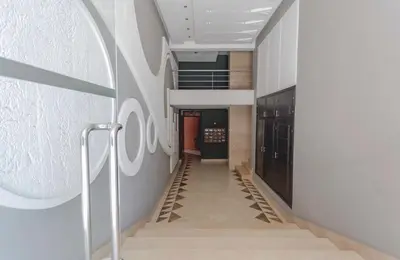 a hallway with stairs in a building at Stylish Studio(WiFi, Netflix, Pool, AC, Nespresso) in Marrakech