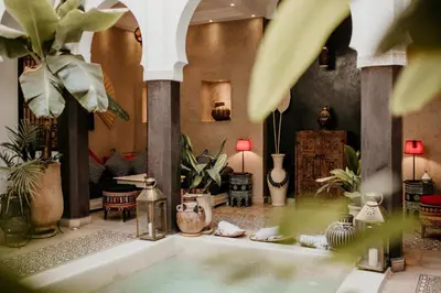 a bathroom with a bath tub with plants in it at Riad Alnadine in Marrakech